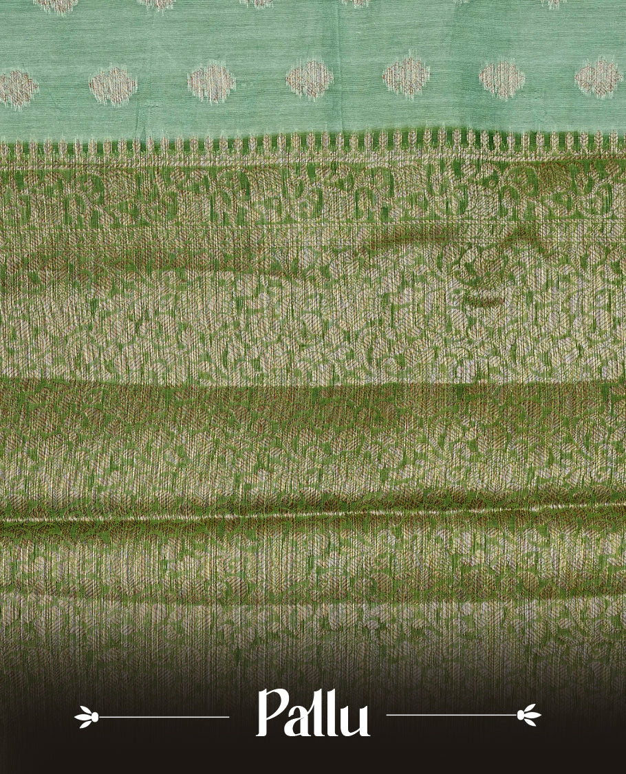 Pista green colour banaras silk saree featuring gold zari buttas on body, complemented by contrast Dark green with gold zari border, comes with matching blouse piece.