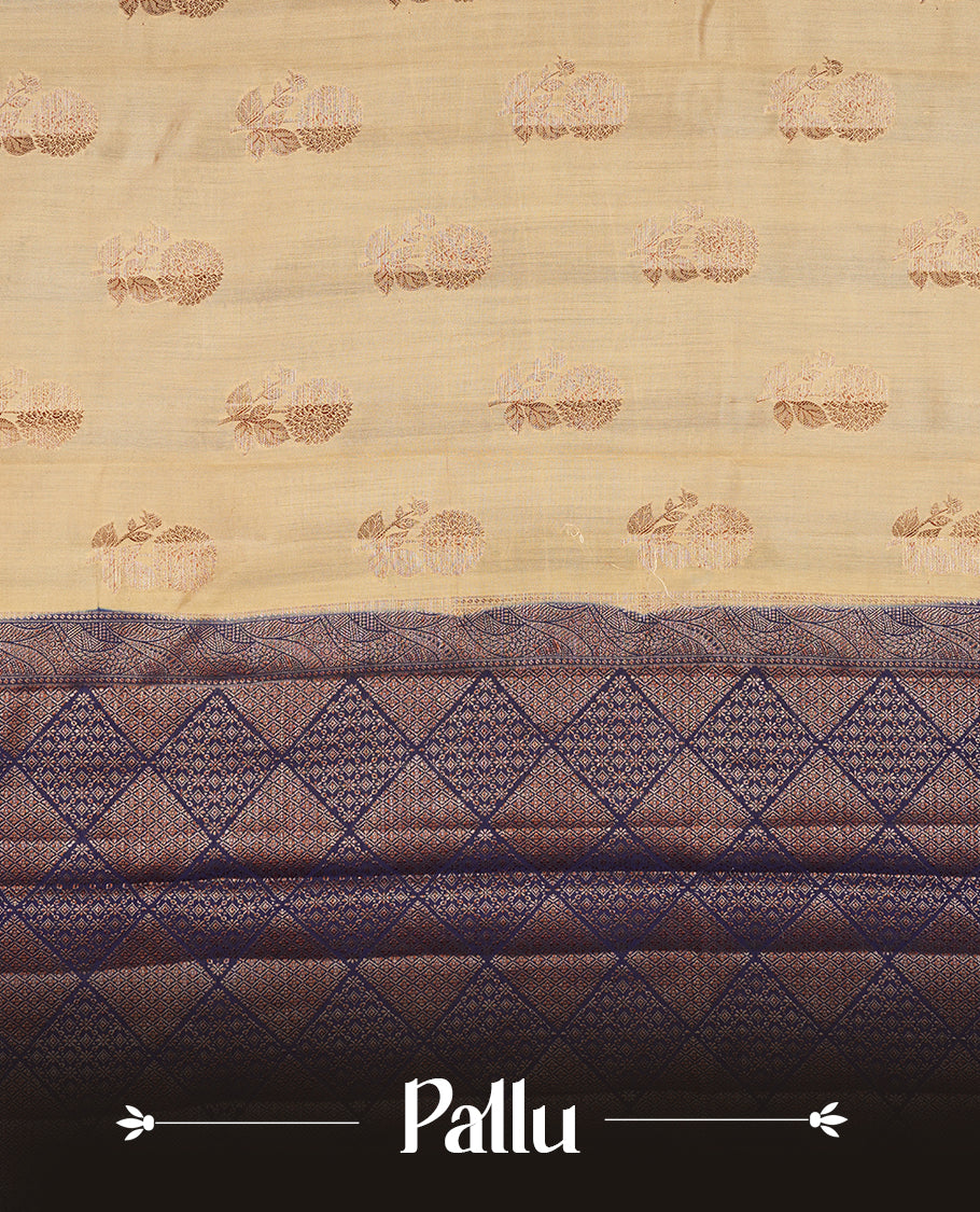 Cream beige Banaras soft silk saree with gold Floral motifs on body, with contrast Blue colour floral pattern on pallu, border, and Matching blouse.