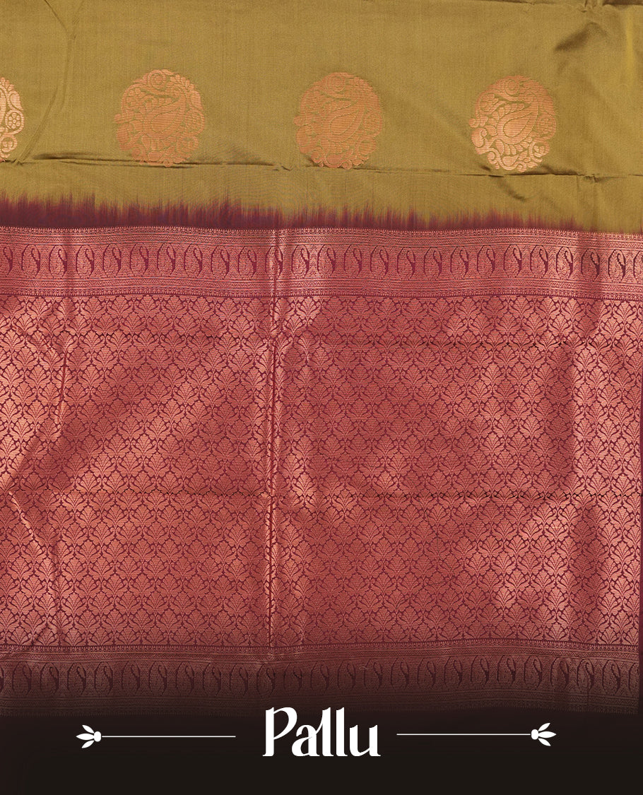 Mehandi colour Semi Silk Saree with copper zari stripes on the body, paired with a contrast dark brown colour pallu with copper zari traditioal border, and a matching blouse piece.