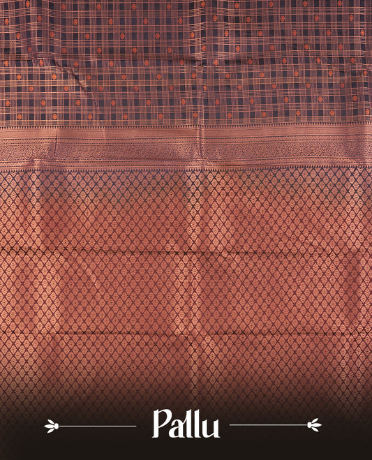 Dark blue colour Semi Silk Saree with copper zari checkered on the body, paired with a contrast chocolate brown colour pallu with copper zari traditioal border, and a matching blouse piece.