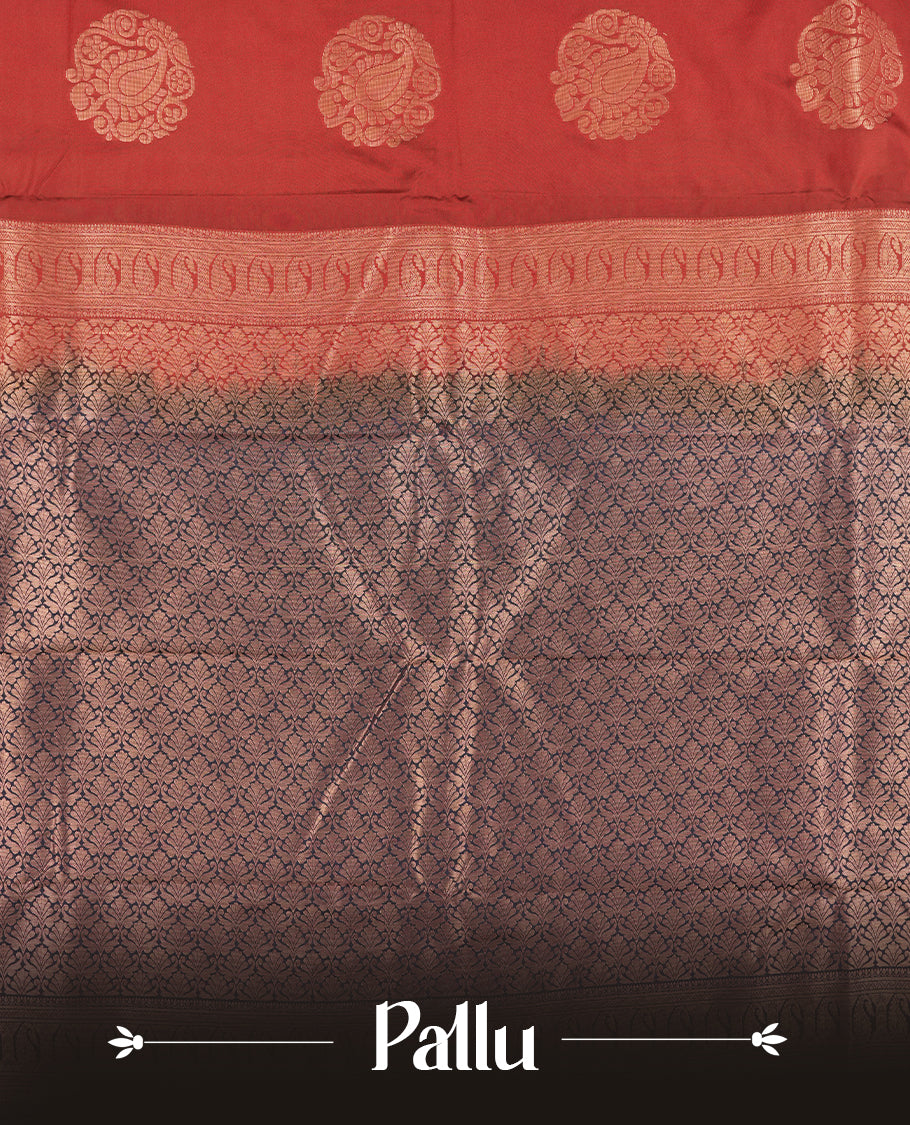 Burgundy colour Semi Silk Saree with gold zari motifs on the body, paired with a contrast Dark blue colour pallu with copper zari traditioal border, and a matching blouse piece.