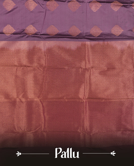 Light purple colour Semi Silk Saree with gold zari motifs on the body, paired with a contrast Wine colour pallu with copper zari traditioal border, and a matching blouse piece.
