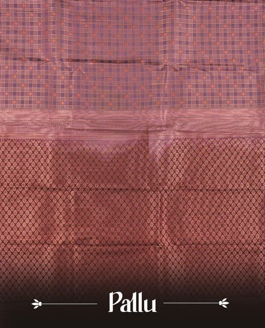 Dusty purple colour Semi Silk Saree with copper zari checkered on the body, paired with a contrast Dark maroon colour pallu with copper zari traditioal border, and a matching blouse piece.