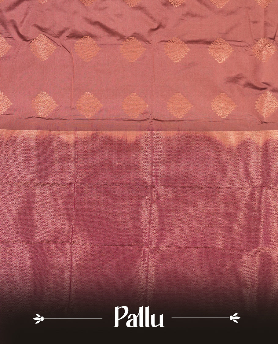 Dusty Rose colour Semi Silk Saree with copper zari motifs on the body, paired with a contrast Dark purple colour pallu with copper zari traditioal border, and a matching blouse piece.