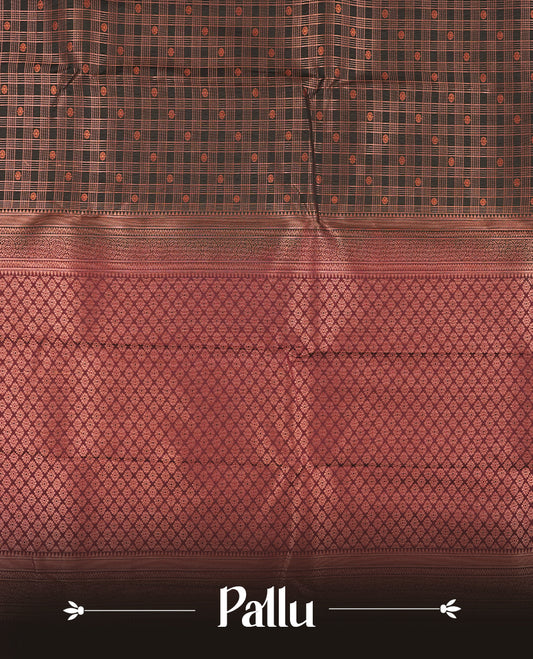 Black colour Semi Silk Saree with copper zari checkered on the body, paired with a contrast chocolate brown colour pallu with coppper zari traditioal border, and a matching blouse piece.