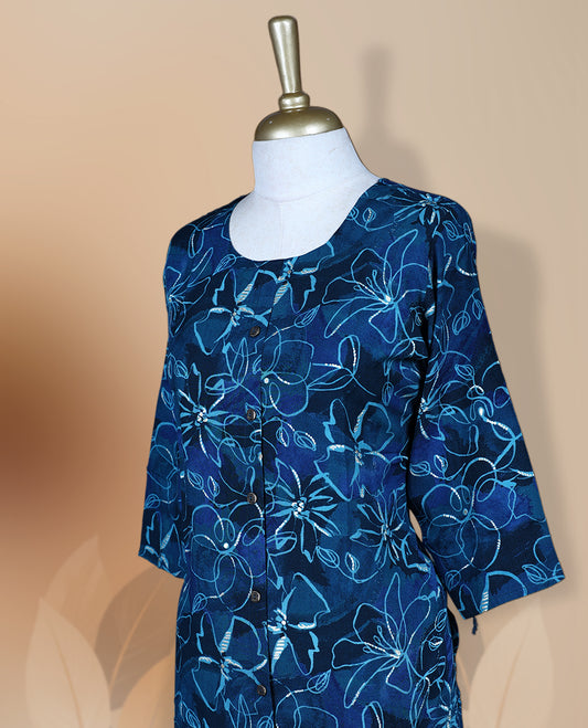 Navy blue colour kurthi adorned with delicate floral prints, featuring a round neckline and three quarter sleeves & Crafted for comfort and style, perfect for casual and semi formal occasions.