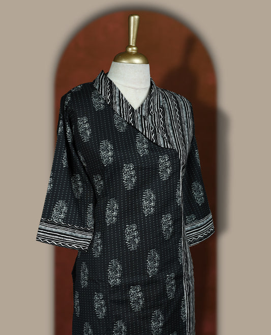Black colour cotton coord set with floral and striped handblock prints, Features a stylish overlay design and elbow length sleeves & paired with matching striped wide leg pants.