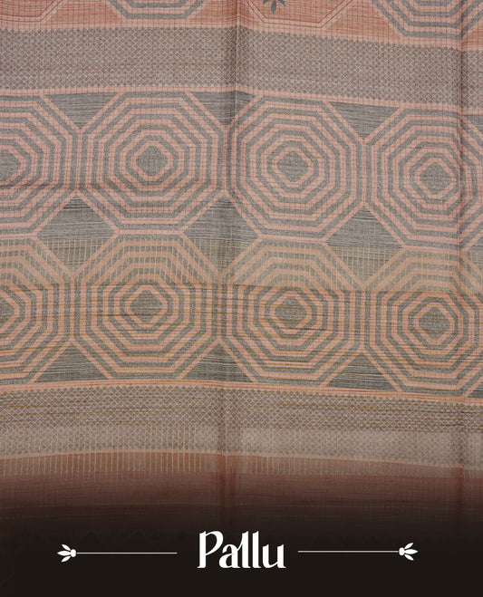 Muted brown colour semi tussar silk saree featuring grey geometric print and zari check pattern across body, self colour border and pallu, paired with matching blouse piece.