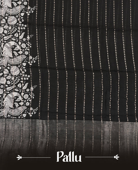 Black colour chanderi silk saree with gold zari strip pattern On body, compilmented by self colour border with antique zari pattern & white peacock & kodi print pattern and a matching blouse.