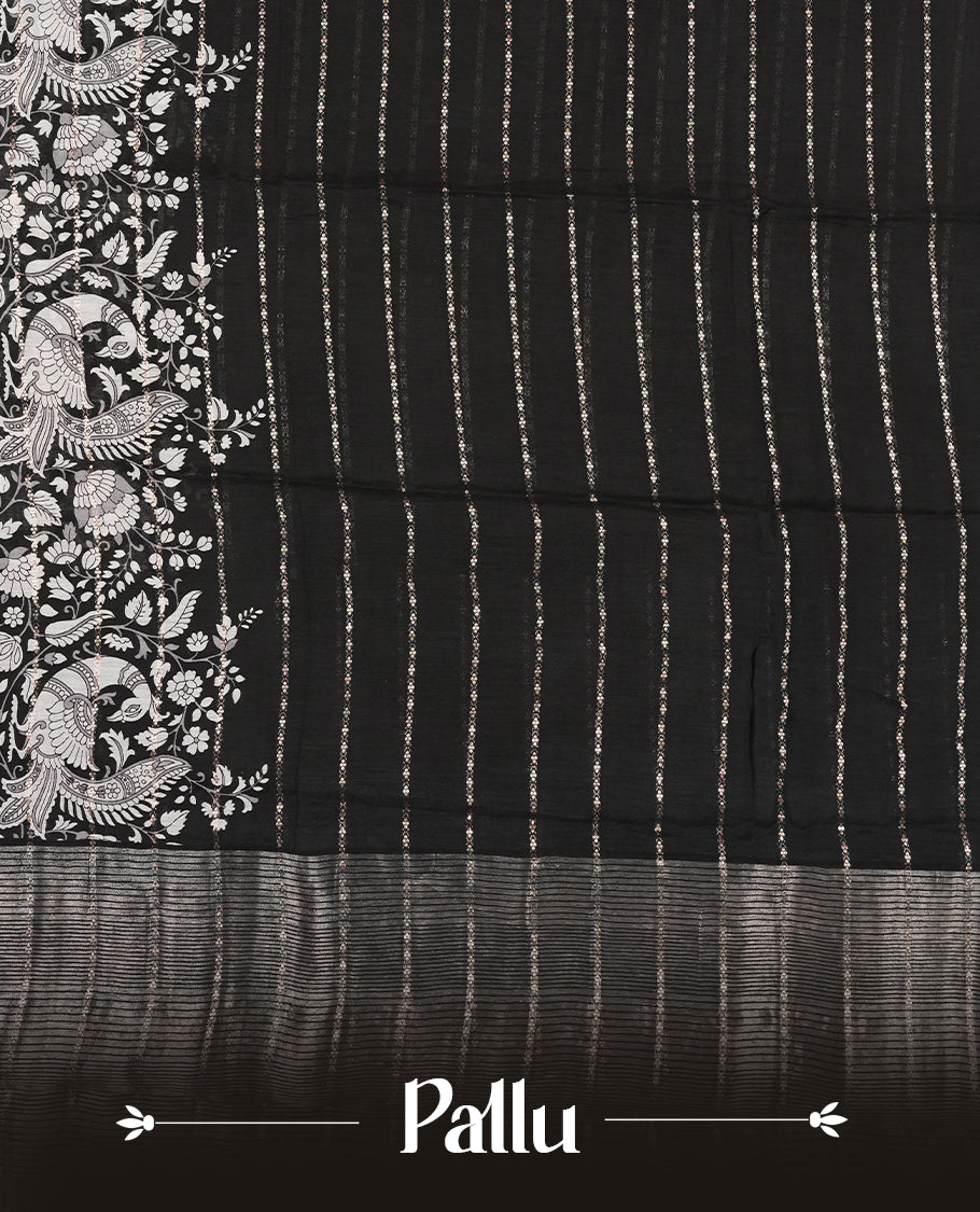 Black colour chanderi silk saree with gold zari strip pattern On body, compilmented by self colour border with antique zari pattern & white peacock & kodi print pattern and a matching blouse.