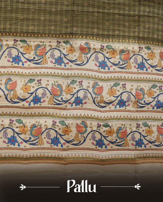 Olive green colour semi tusser silk saree featuring gold zari check pattern with floral butti motifs, with contrast floral kodi & bird pattern and paired with matching blouse.