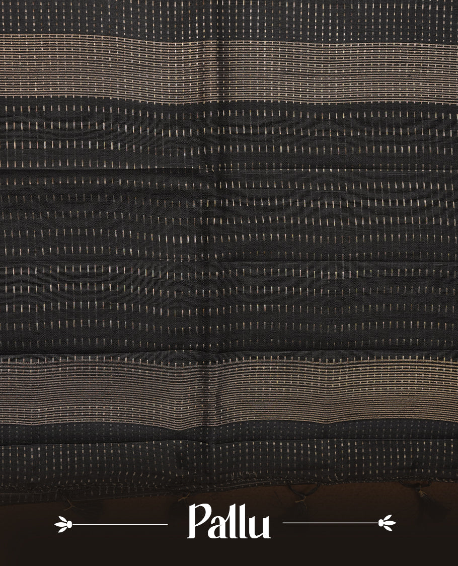 Black colour semi tussar silk saree highlighting gold zari dotted stripes, self colour border and contrast dark gold pallu and comes with matching blouse piece.