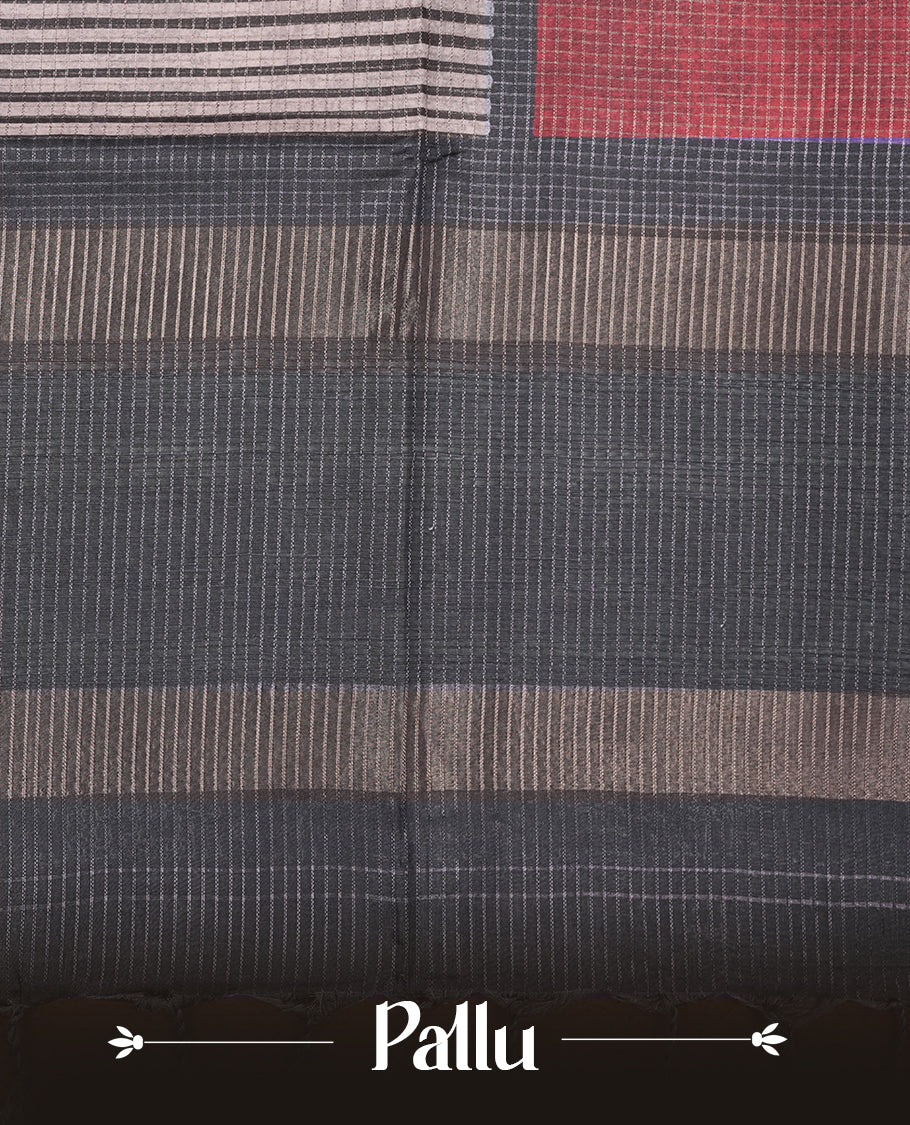 Soft charcoal grey colour semi tussar silk saree with fine striped texture and a subtle geometric body design. Finished with a classic striped pallu and tassel edges.