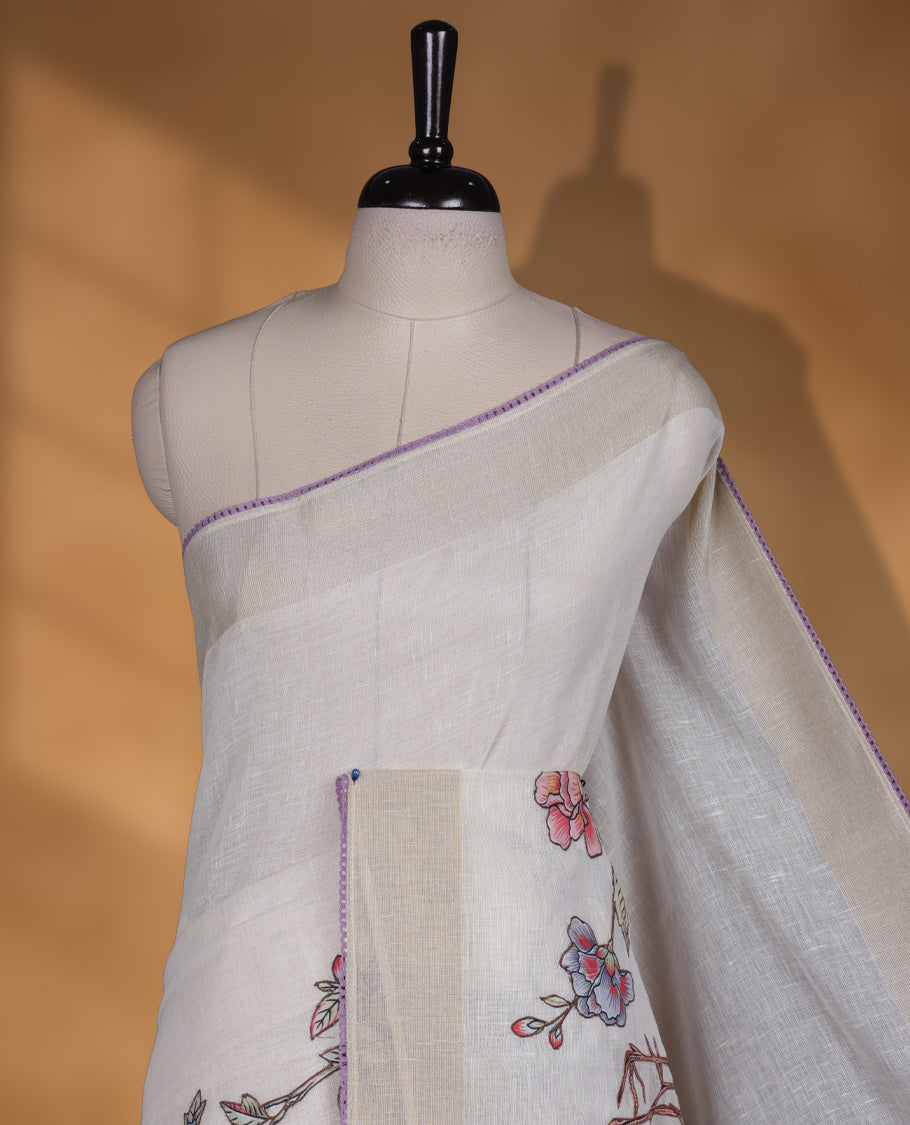 Cream colour cotton linen silk saree featuring Floral  & brids printed pattern on body, golden simple border with lavender colour pallu and comes with a matching blouse