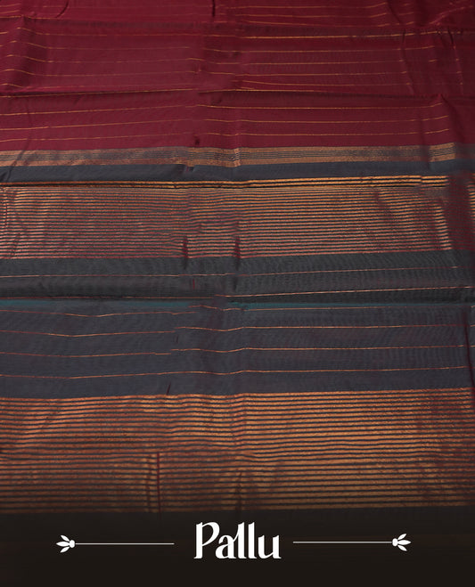 Maroon colour silk cotton saree featuring with delicate vertical copper zari lines on the body, Crafted without a border for a classy touch , Navy blue colour contrasted pallu & Comes with a matching blouse.
