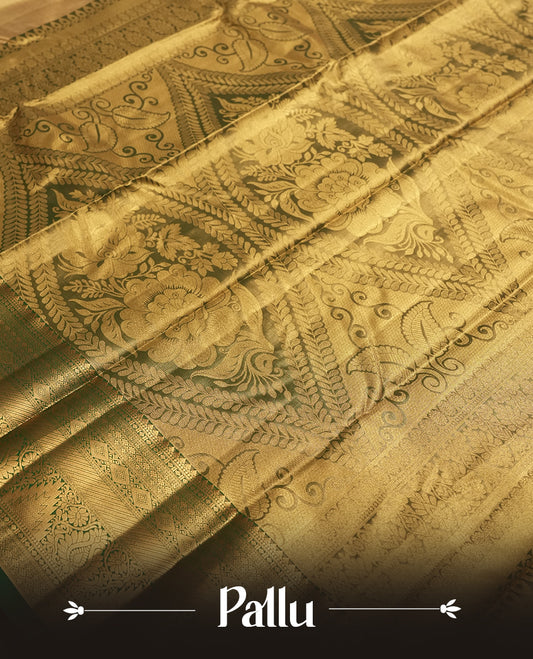 Golden colour Tissue Brocade Saree features intricate a green colour flower Motifs on body and a green colour traditional border & pallu with patterns, paired with matching blouse