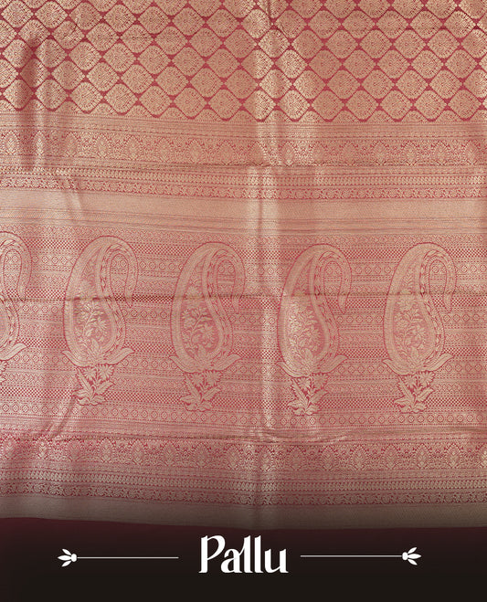 Deep brown colour semi silk brocade saree featuring intricate Gold butta patterns across the body, complemented by a rich self colour woven border and pallu, paired with a matching blouse.