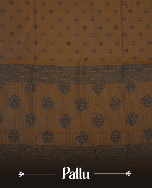 Brown colour poly cotton saree with black floral butti motifs on the body, paired with a matching pallu featuring black ornate floral jaal and stripes on the border, and a coordinated all‑over black paisley printed blouse piece.