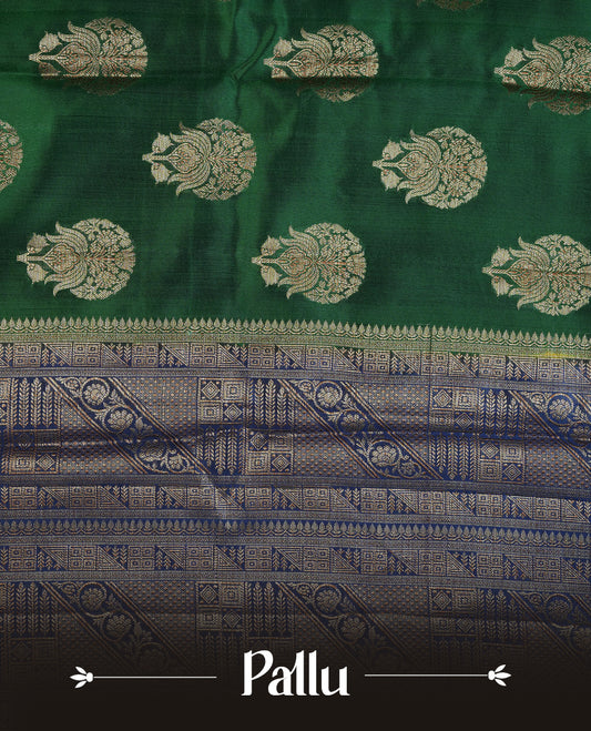 Dark green colour Pure tussar Banarasi saree featuring Gold zari motifs on body, a contrast navy blue colour gold zari border, and a matching blouse piece.