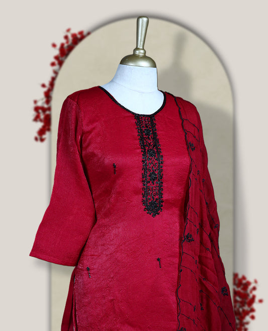Maroon churidar set adorned with intricate black cut bead work on the neckline, paired with a matching bottom & The set comes with a lightweight embroidered dupatta, adding elegance and charm to your ethnic look.