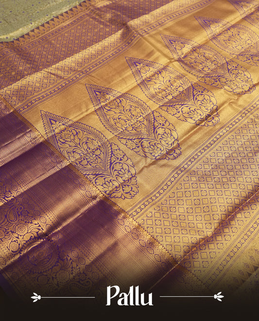 Pastel green and Antique silver Zari Tissue Brocade Saree features intricate coloured floral Motifs on body and a navy blue colour with traditional border & pallu, paired with matching blouse