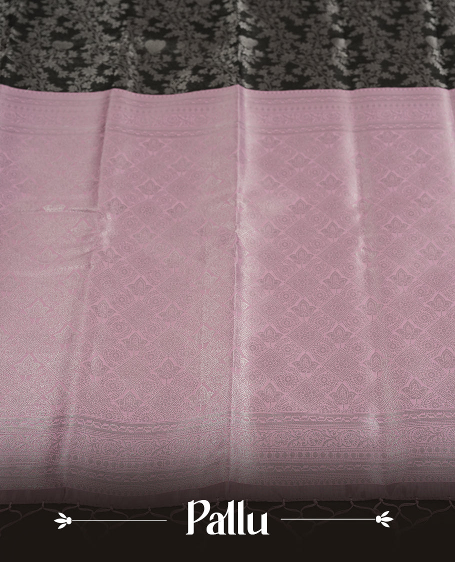 Charcoal Black colour Semi Silk Saree with Silver Zari Floral Self-Weave on the Body, Contrasting Pastel Mauve Zari Woven Pallu and Border with Intricate Geometric Motifs and Tassels, Paired with Coordinated Blouse Piece