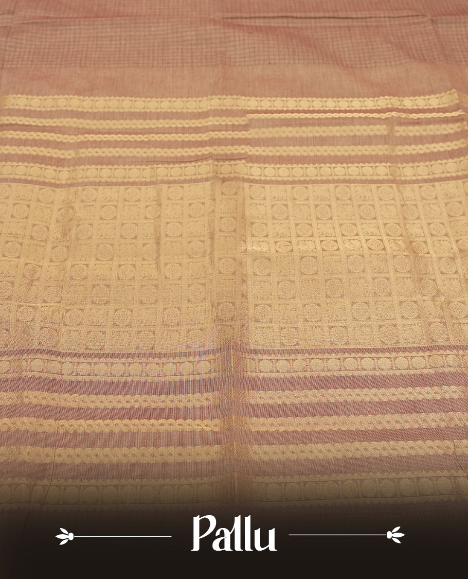 Brown colour checked Chettinad cotton saree featuring intricate black checks on the body, enhanced with golden zari borders and temple motifs &  Comes with a matching blouse piece for a traditional look.