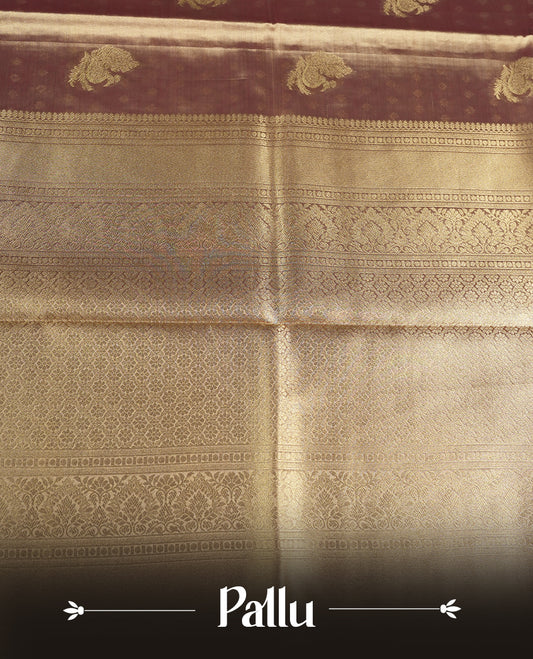 Antique Gold colour tissue banaras silk saree featuring antique gold zari motifs on the body with rich traditional zari border and pallu, paired with a matching blouse piece.