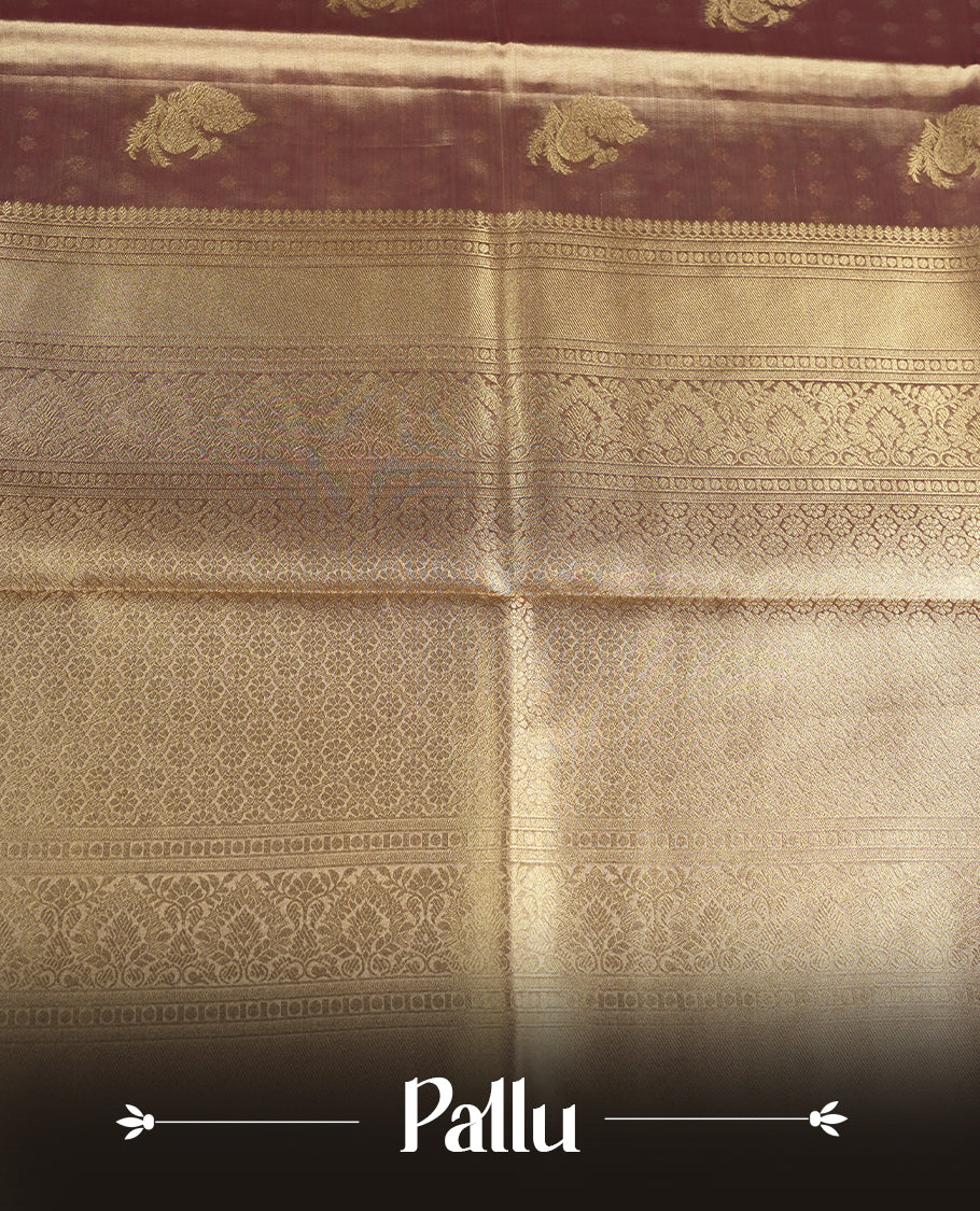 Antique Gold colour tissue banaras silk saree featuring antique gold zari motifs on the body with rich traditional zari border and pallu, paired with a matching blouse piece.