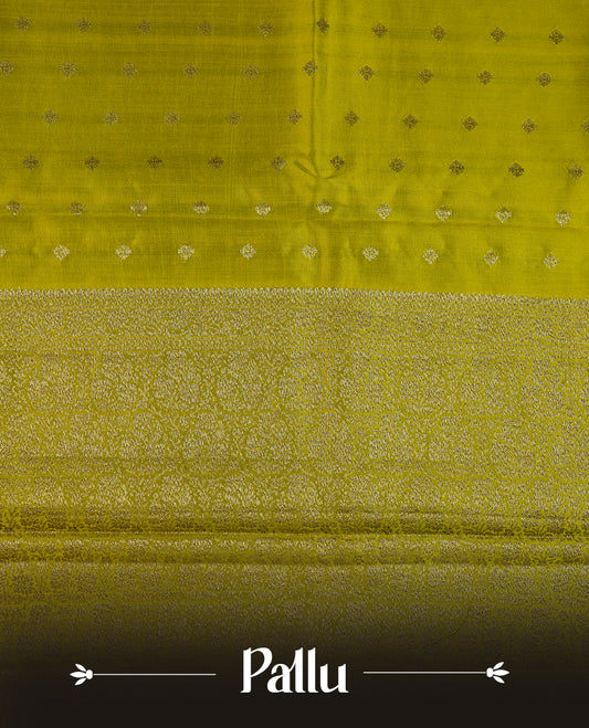 Olive colour pure tussar Banarasi saree featuring Gold zari motifs on body, self colour gold zari border, and a matching blouse piece.