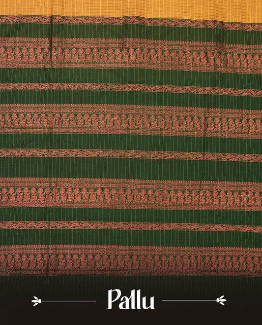 Mustard yellow coloured mixed Kalyani cotton saree featuring copper zari checks on the body, complemented by a dark green coloured border and pallu adorned with copper zari patterns, Paired with a matching blouse.