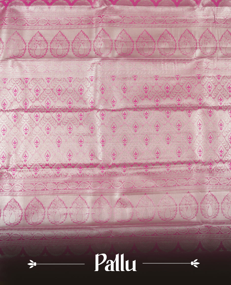 Bright pink colour and silver Zari Tissue Brocade Saree features intricate floral Motifs on body and dark pink contrast with silver traditional border & pallu, paired with matching blouse
