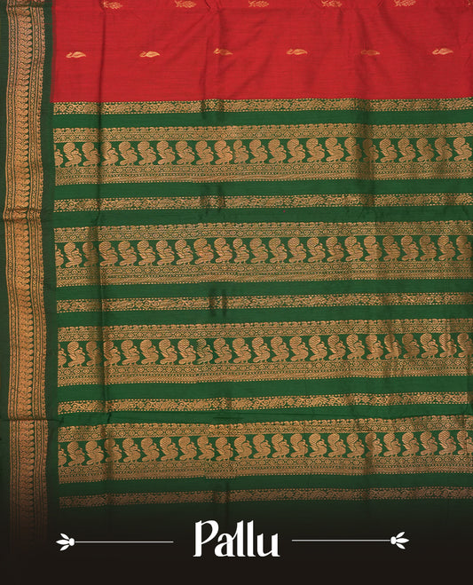 Maroon colour Kalyani Cotton saree with deep green border and pallu, adorned with copper zari motifs and intricate weaving & Comes with a matching blouse piece.