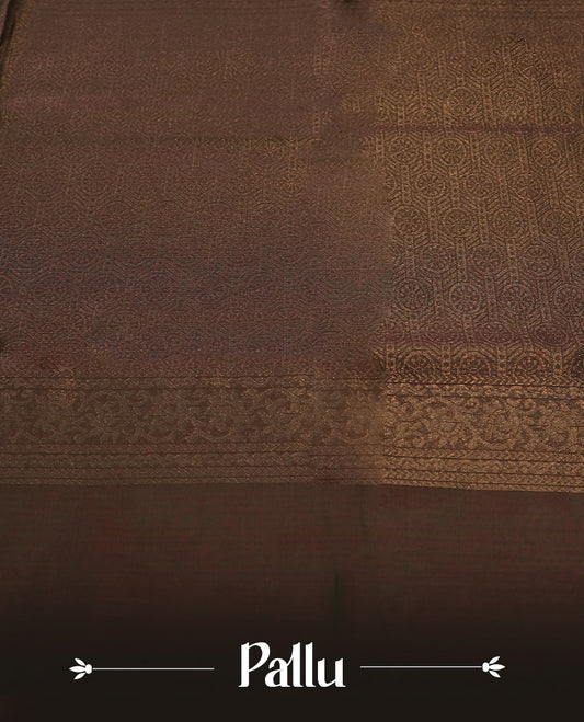 Dark greeen colour soft silk cotton saree adorned with copper zari motifs and a shimmering copper zari border, Enhanced by a beautifully rich maroon colour woven pallu & Comes with a matching blouse piece for a complete look.