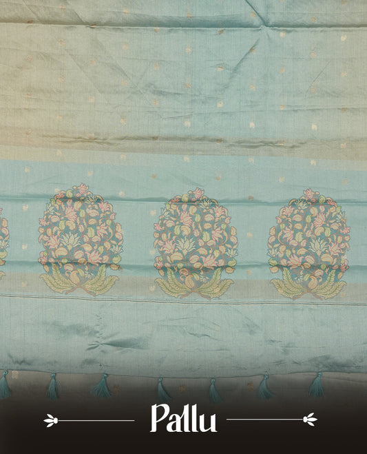 cream beige colour semi tussar saree adorned with gold zari motifs across the body and Floral pattern contrast Light blue colour on border, paired with a matching blouse.