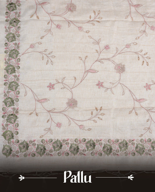 Cream  colour semi tusser silk saree featuring with Green colour thread embroidery kodi pattern all over body, pallu, border  and paired with matching blouse piece.