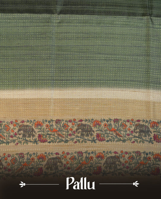 Castleton green colour tussar saree featuring golden zari dot stripped pattern on the body, complemented by a contrast cream colour mutlicolour floral kodi & animal print on border & pallu, paired with a matching blouse.