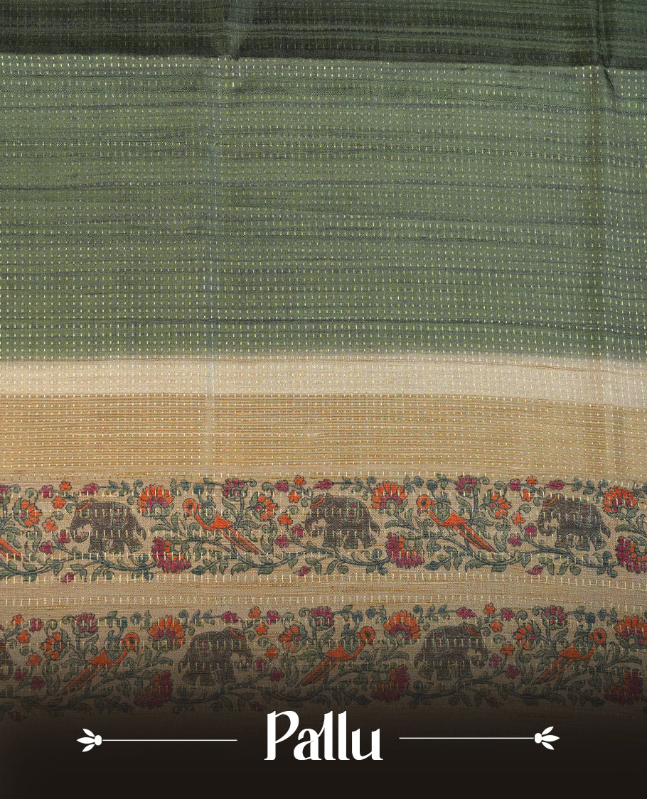 Castleton green colour tussar saree featuring golden zari dot stripped pattern on the body, complemented by a contrast cream colour mutlicolour floral kodi & animal print on border & pallu, paired with a matching blouse.