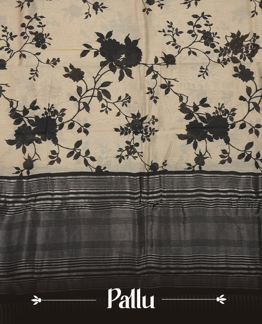 Cream colour Viscos semi printed saree featuring a contrast black light golden zari border, abstract Black printed motifs on the body, and comes with a matching blouse