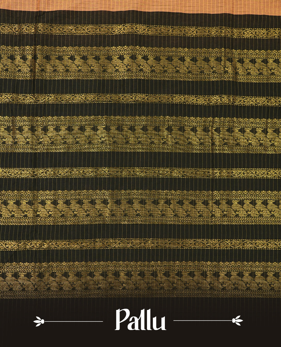 Burnt orange coloured mixed Kalyani cotton saree featuring golden zari checks on the body, complemented by a black coloured border and pallu adorned with golden zari patterns, Paired with a matching blouse.