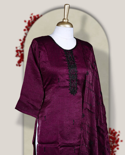 Grape colour  churidar set adorned with intricate black cut bead work on the neckline, paired with a matching bottom & The set comes with a lightweight embroidered dupatta, adding elegance and charm to your ethnic look.