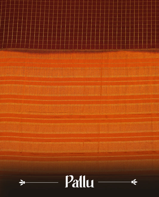 Dark Choclate colour mysore crepe saree with gold zari check pattern on body, complemented by contrast dark mustard colour border featuring peacock and chakkram motifs, paired with matching blouse.