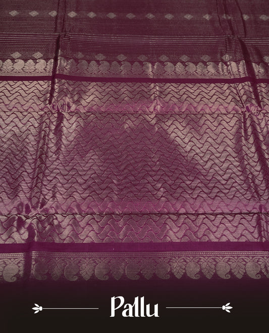Dark Maroon colour pure Handloom cotton saree featuring fine golden stripes with delicate motifs, paired with a rich zari magenta border for a traditional yet elegant look, perfect for graceful occasions & Comes with matching blouse.