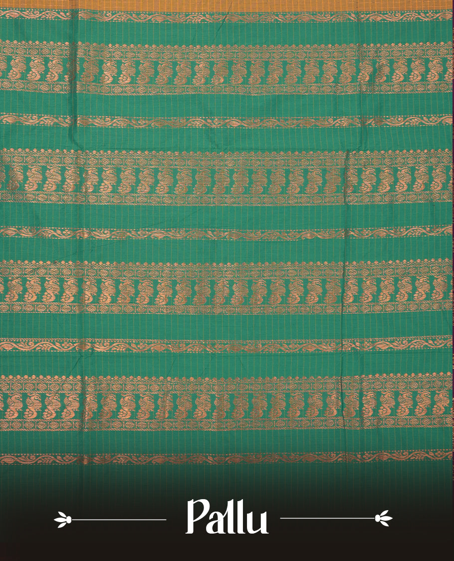 Mustard yellow coloured mixed Kalyani cotton saree featuring copper zari checks on the body, complemented by a dusty green coloured border and pallu adorned with copper zari patterns, Paired with a matching blouse.