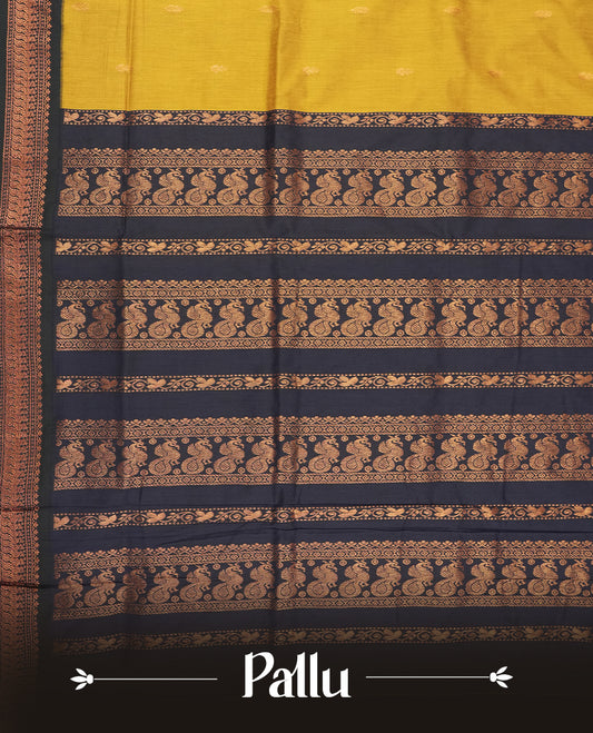 Golden yellow colour Kalyani cotton saree with intricate small motifs all over, paired with a contrasting navy blue  rich zari woven border and pallu & Comes with a matching blouse piece.