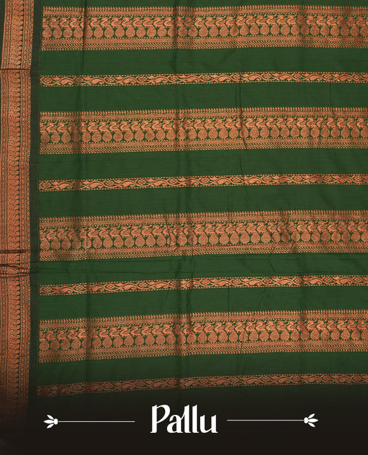 Maroon colour Kalyani cotton saree with subtle zari motifs all over, paired with a contrasting green rich copper zari woven border and pallu & comes with a matching blouse piece.