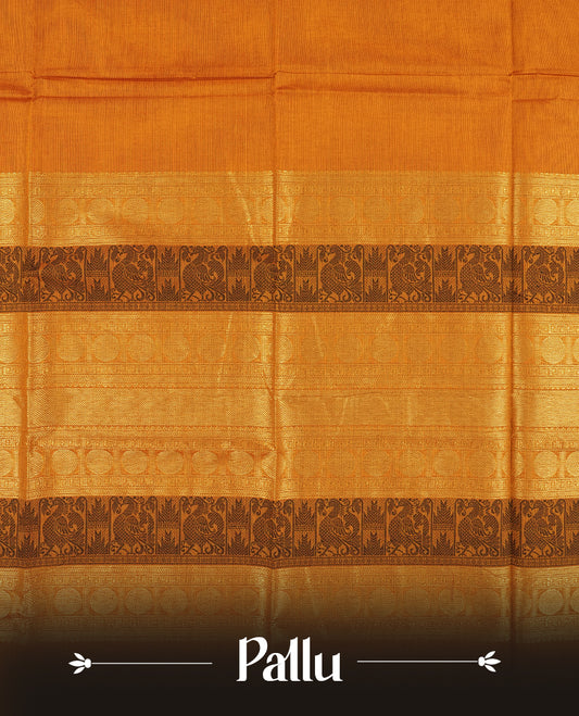 Mustard Orange colour Chettinad cotton saree adorned with small woven motifs on the body, The saree features a deep maroon border highlighted with intricate golden zari circular patterns and comes with a matching blouse piece.