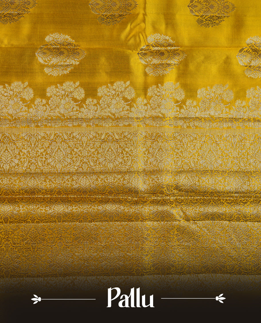 Yellow colour pure tussar Banarasi saree featuring Gold zari motifs on body, self colour border, and a contrast green colour blouse piece.