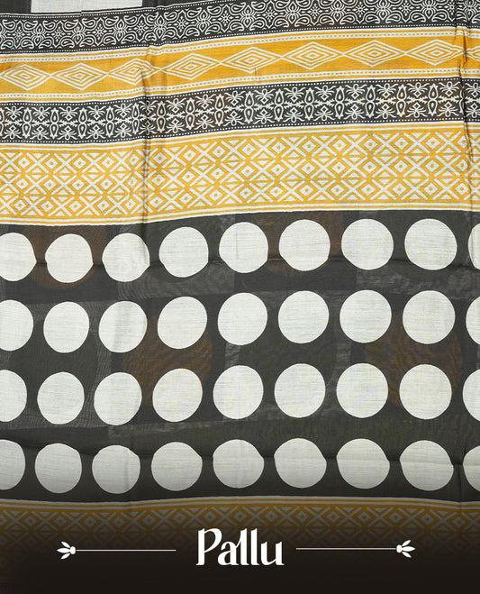 Multicolor mixed chanderi cotton saree with mustard-yellow and green circles on black and off-white checkerboard squares, green and golden zari pallu with polka dots and floral motifs, and matching green blouse.