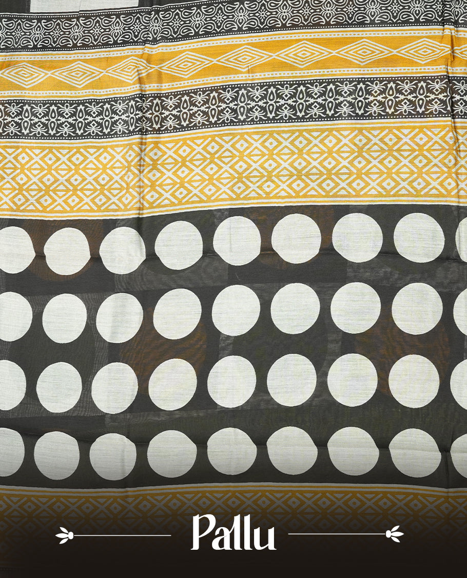 Multicolor mixed chanderi cotton saree with mustard-yellow and green circles on black and off-white checkerboard squares, green and golden zari pallu with polka dots and floral motifs, and matching green blouse.